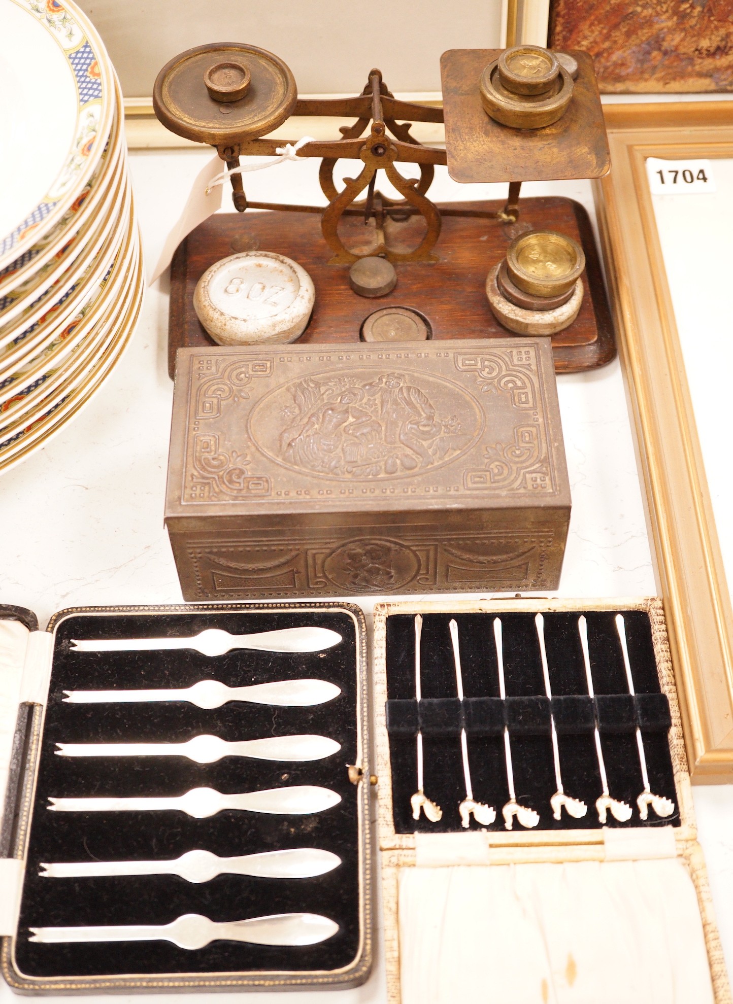A postal scale, cased silver lobster picks, silver cocktail sticks etc